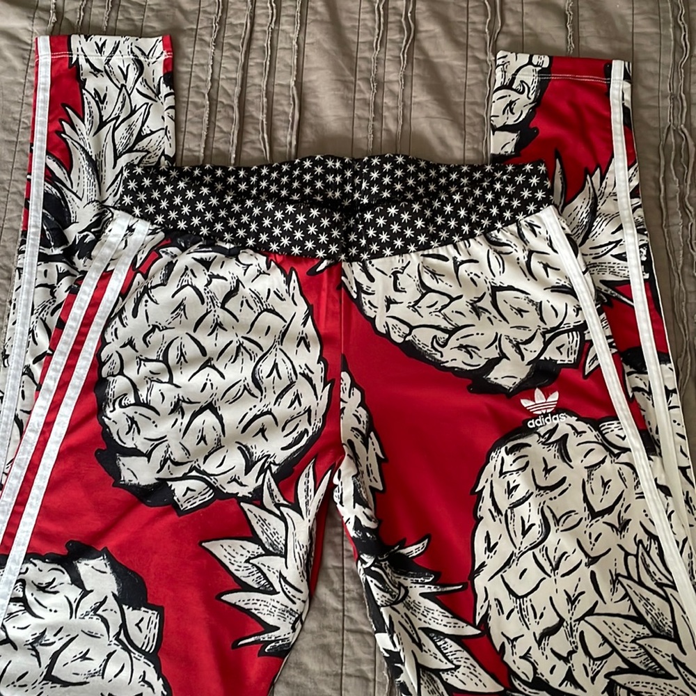 Woman’s gently loved Adidas three strip leggings